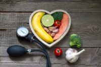 Health heart diet food concept with blood pressure gauge